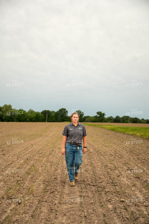 Female Farmer Walking in Field 115721
