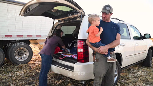 Family Enjoying Harvest Meal in the Field - 545