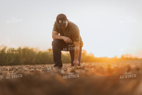Farmer Checks Seed Depth After Planting 7716