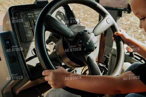 Farm Kid Driving Tractor on Lap 289008