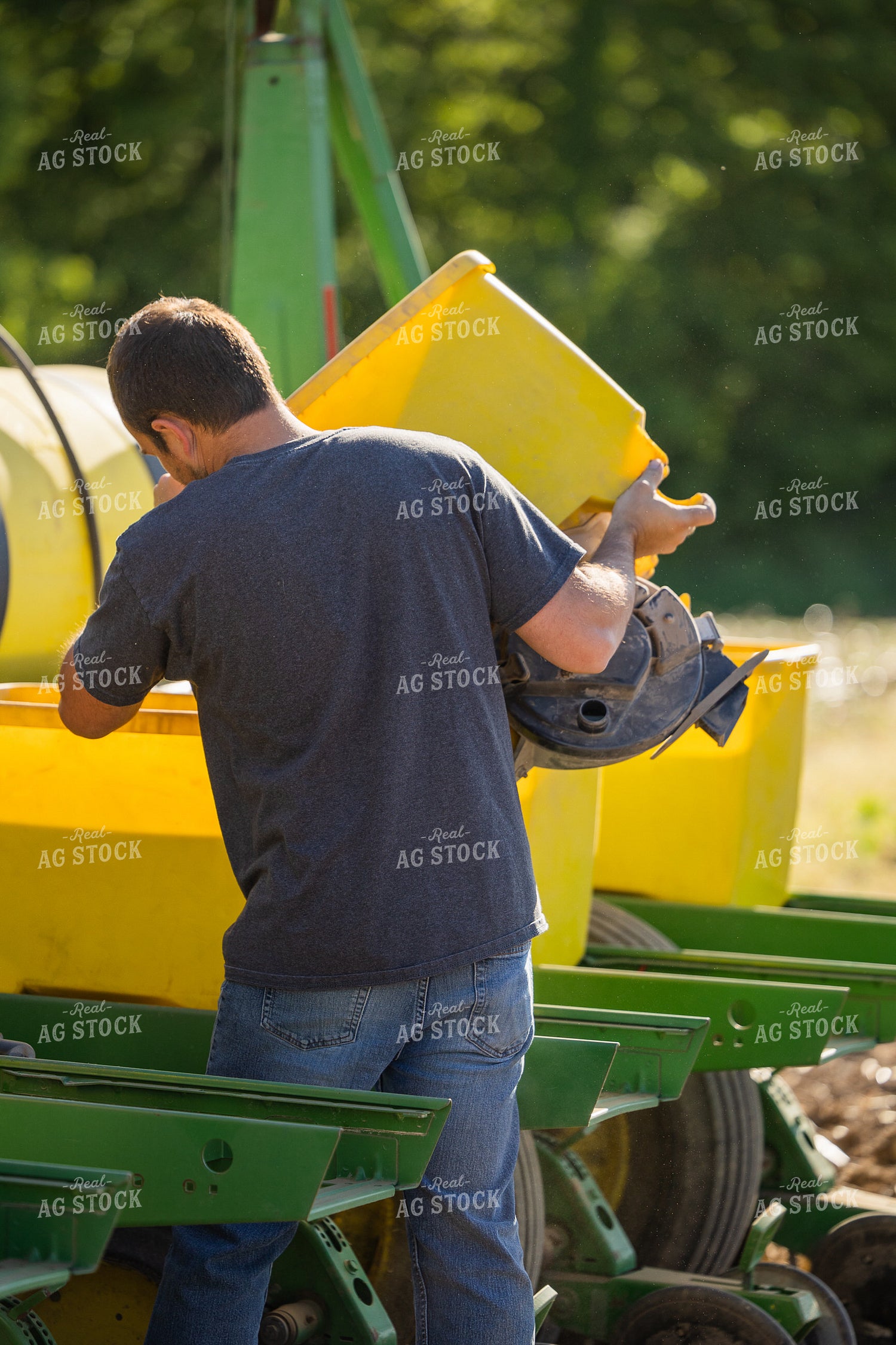 Farmer Dumping Seed Box 104017