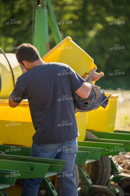 Farmer Dumping Seed Box 104017