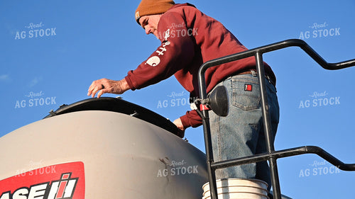Farmer Loading Planter with Seed Tender 25222