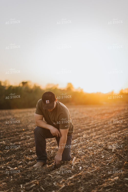 Farmer Checks Seed Depth After Planting 7717