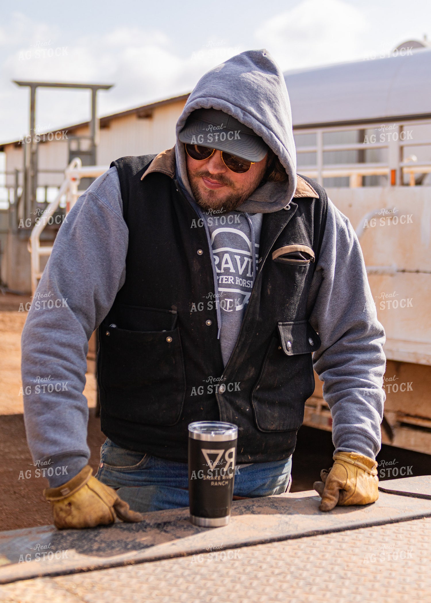 Rancher Leaning on Truck 231089
