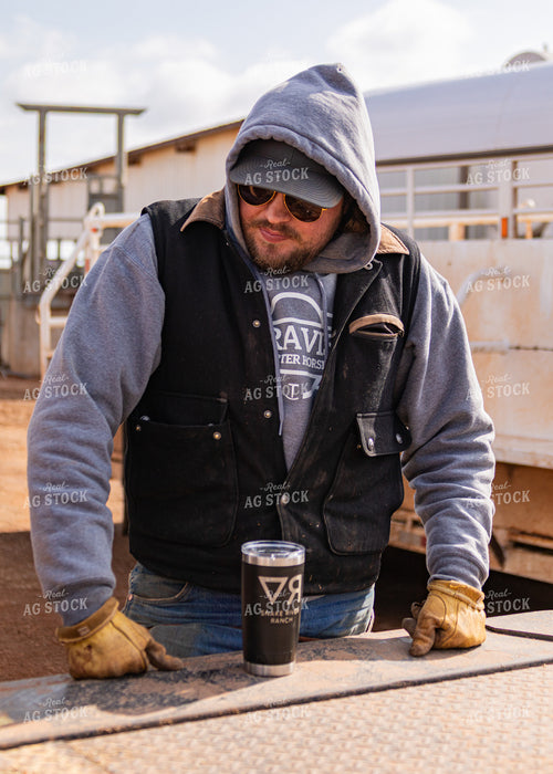 Rancher Leaning on Truck 231089