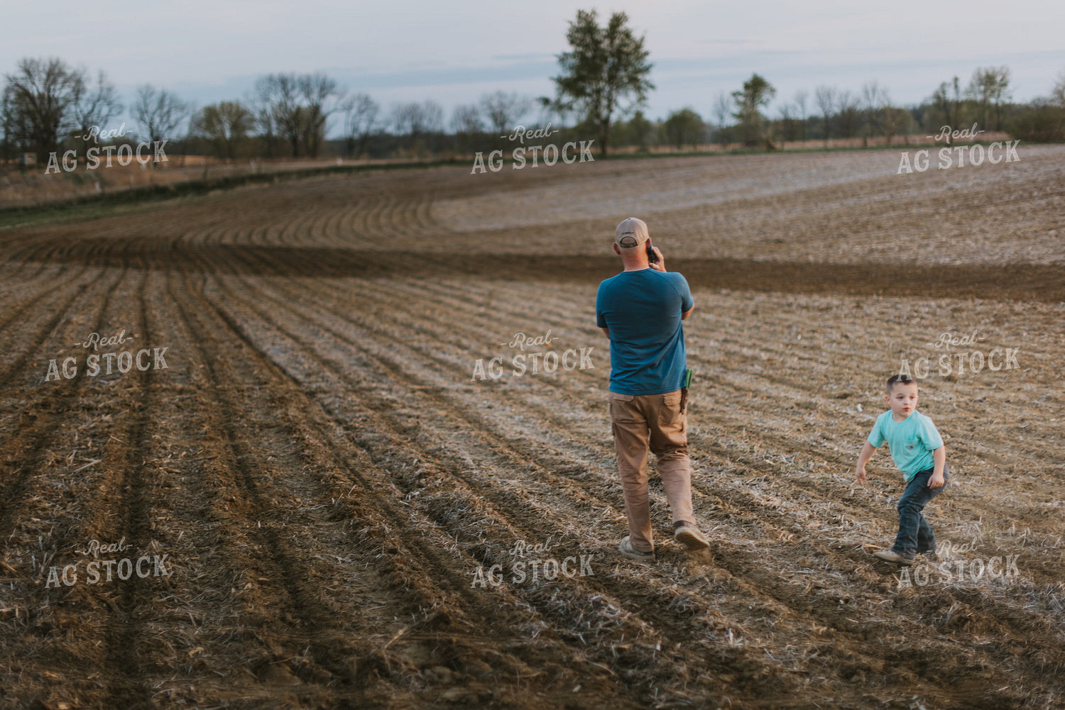 Farmer Talking on Phone in Field 7459