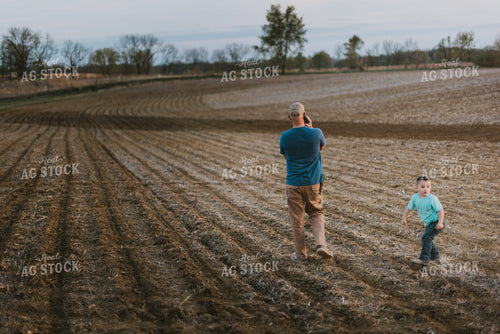 Farmer Talking on Phone in Field 7459