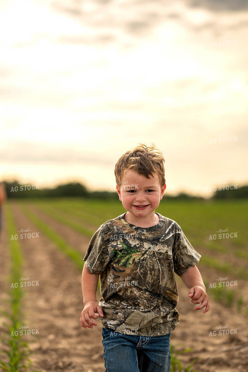 Farm Kid in Early Growth Corn Field 115919