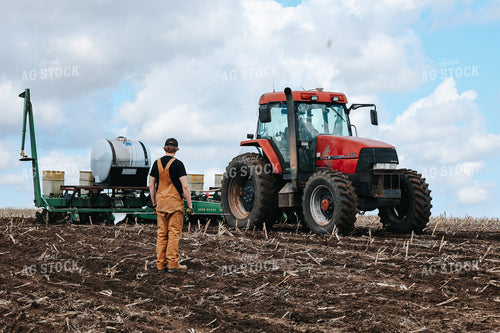 Farmer Standing by Planter 187031
