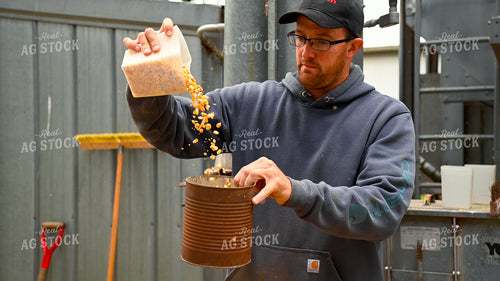Farmer Testing Corn Moisture On-farm Storage 25627