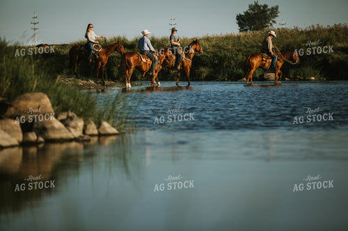 Ranchers on Horses in Creek 6385