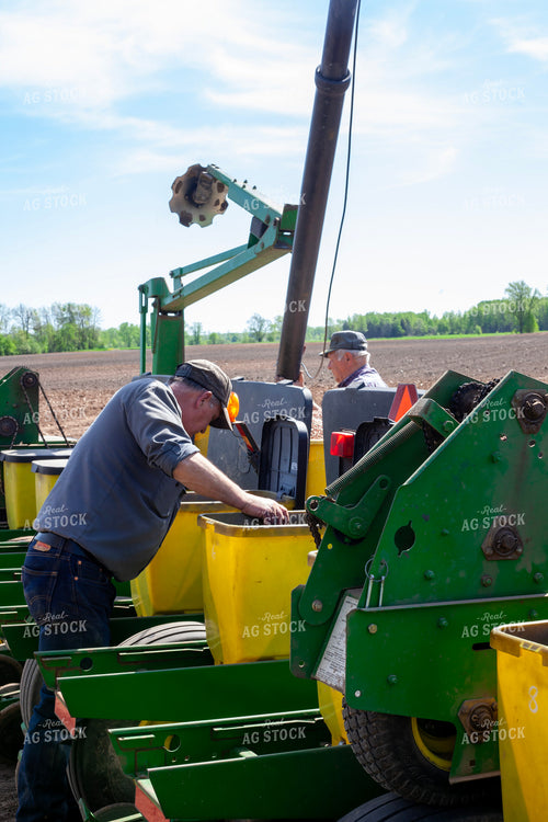 Farmers Working on Planter 132019
