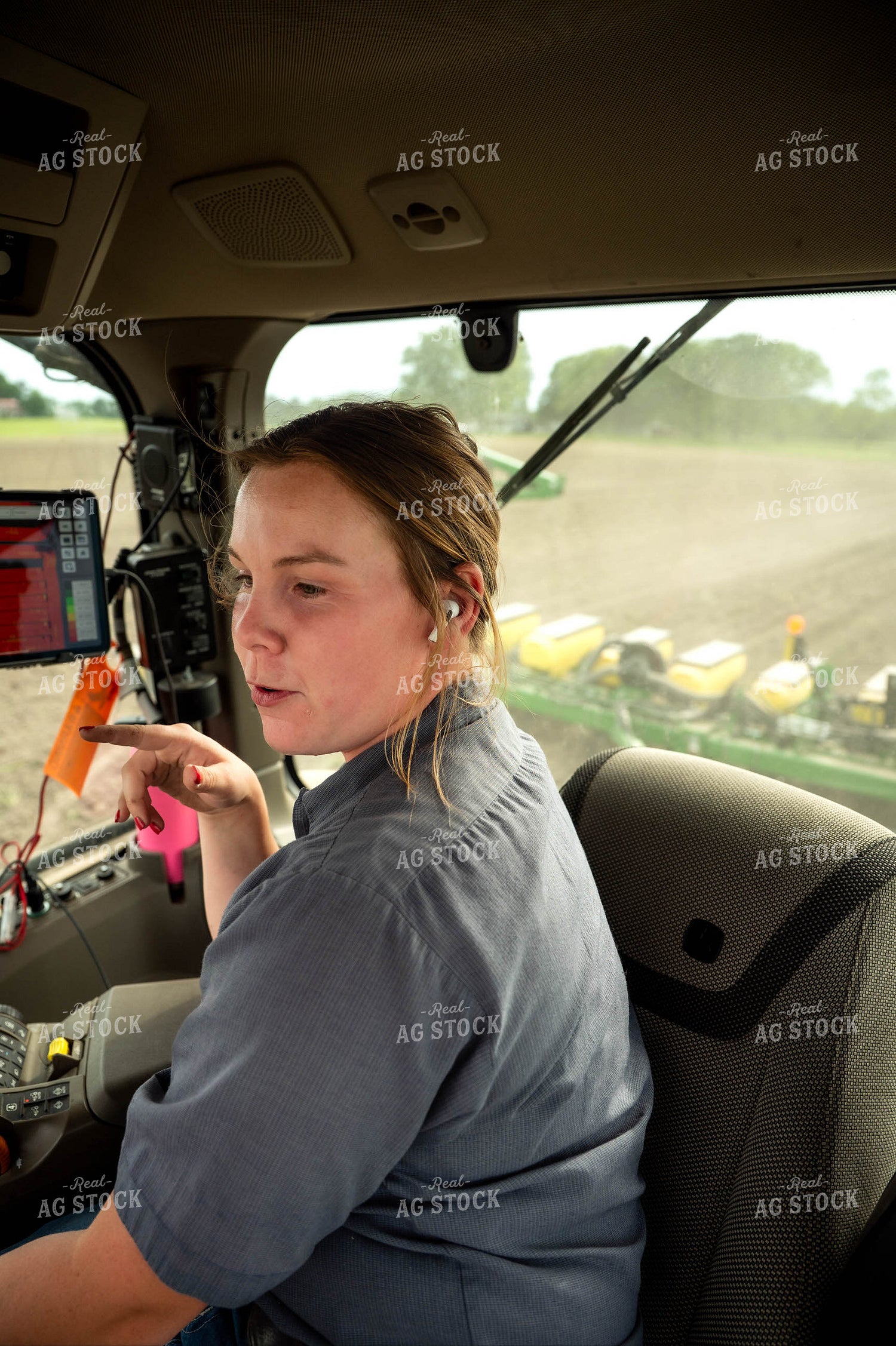 Female Farmer in Tractor Cab 115664