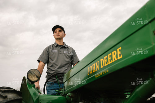 Farmer Operating Tractor 52648