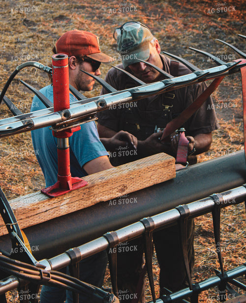 Farmers Fixing Combine 187001