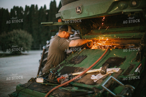Farmer Working on Combine 5152