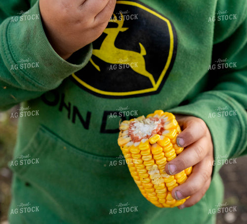 Farm Kid Holding Ear of Corn 185044