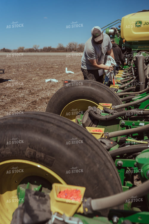 Farmer Filling Planter for Test Plot 196123