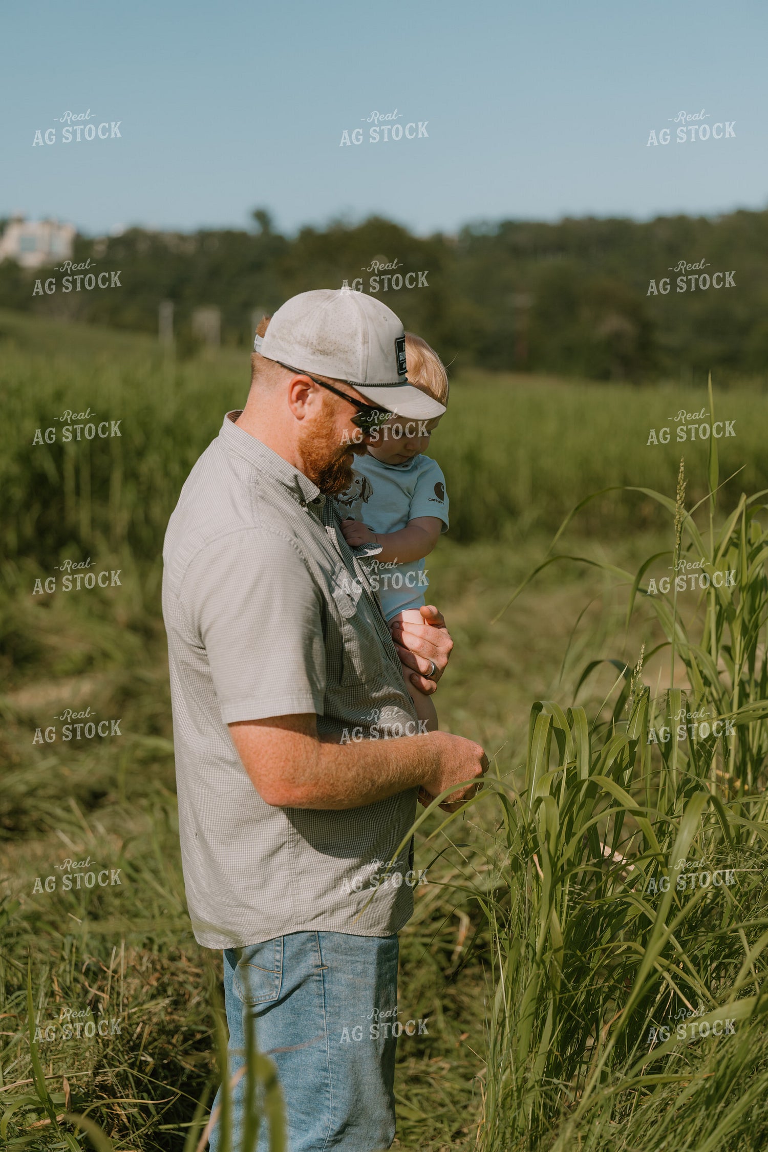 Farmer Checking Crops with Farm Kid 125401