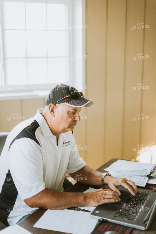 Farmer Working on Computer 7750