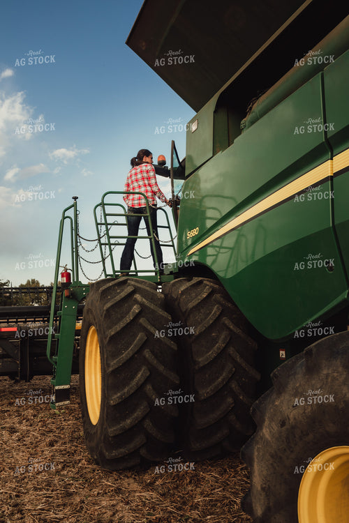Female Farmer Getting In Out of Combine 3496