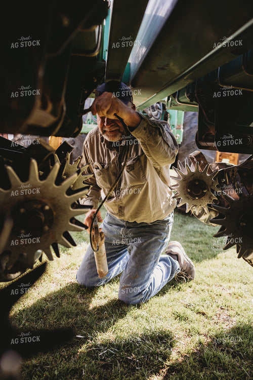 Farmer Greasing Planter 4086