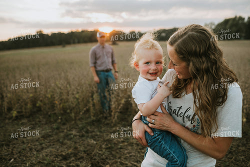 Farm Family Standing in Dried Soybean Field at Sunset 4972
