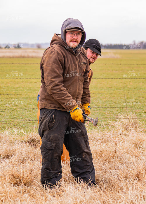 Ranchers Fixing Fence 231076