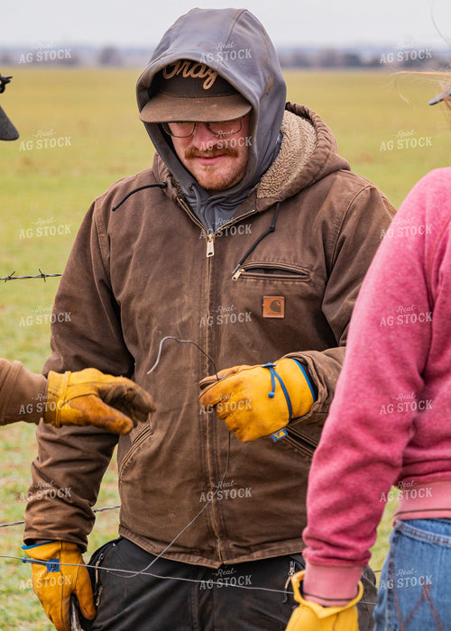 Ranchers Fixing Fence 231064