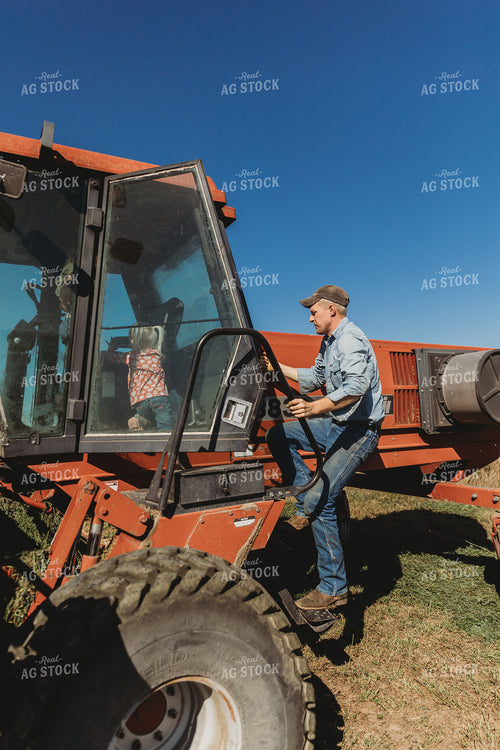 Farmer and Farm Kid Getting In Tractor 61109