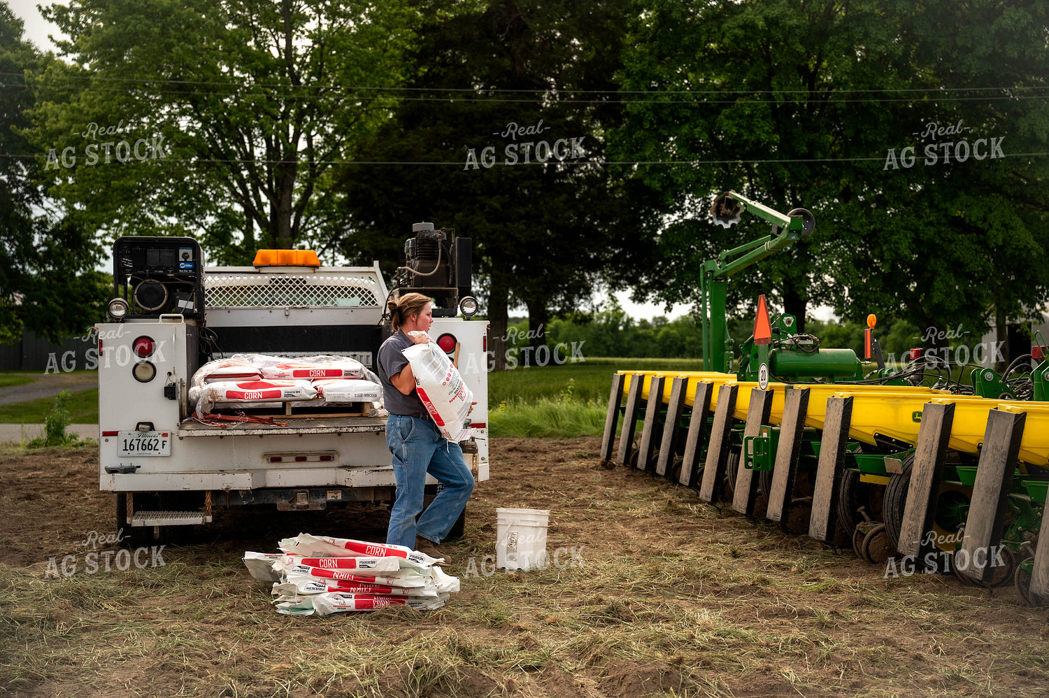Female Farmer Filling Planter 115636