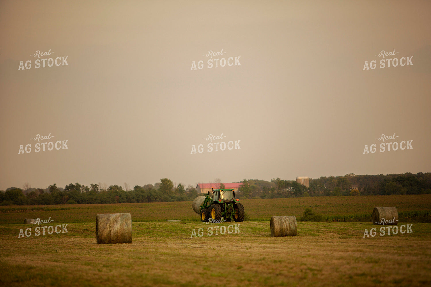 Tractor Lifting Round Hay Bale 5517