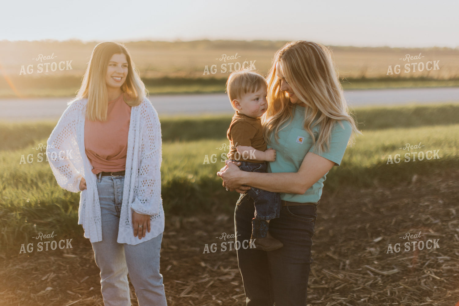 Farm Wife and Child Stand in Field 7690