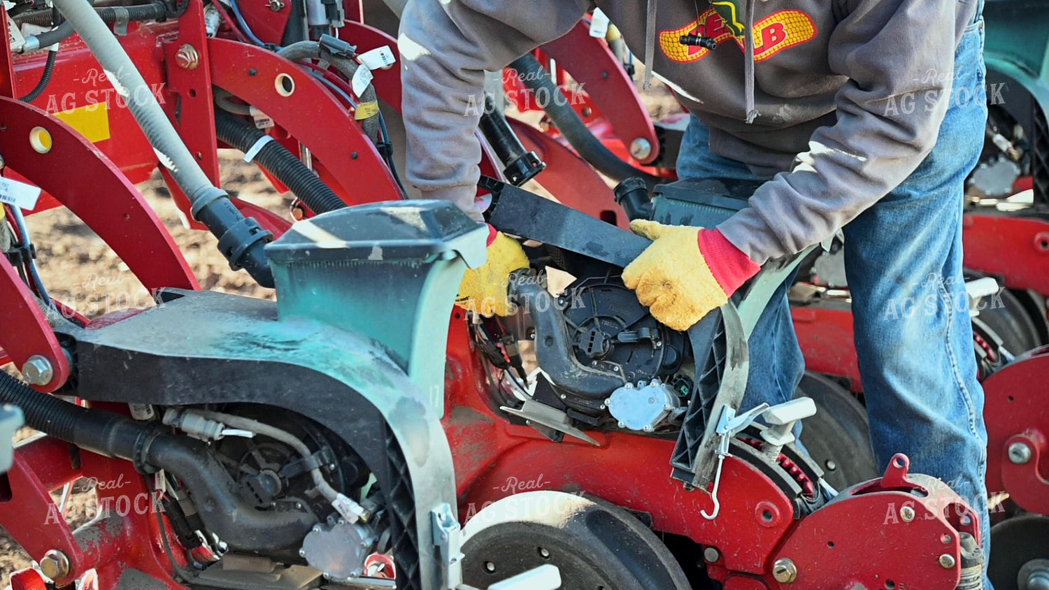 Farmer Repairing Planter 25205