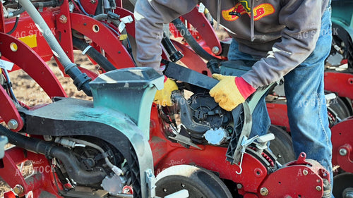 Farmer Repairing Planter 25205