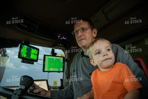 Grandson and Grandfather Farmer in the Combine Cab 25836