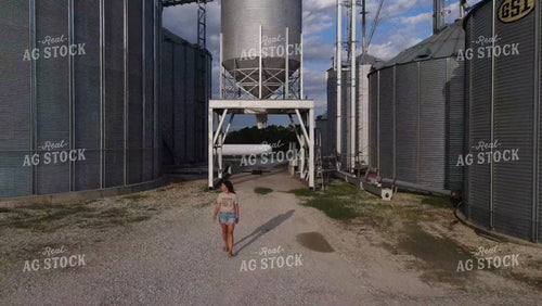 Farm Wife Walking by Grain Bin 9162