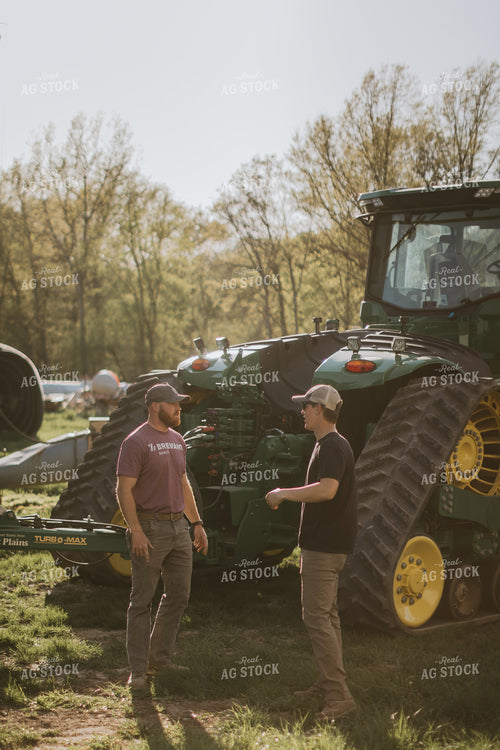 Farmers Talk Outside Tractor 7638