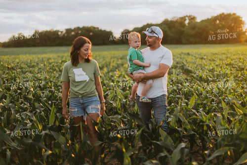 Farm Family Checking Corn 8836