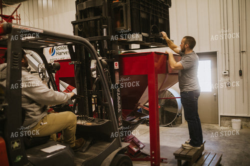 Forklift Operator with Dumping Soybean Bulk Bin 5292