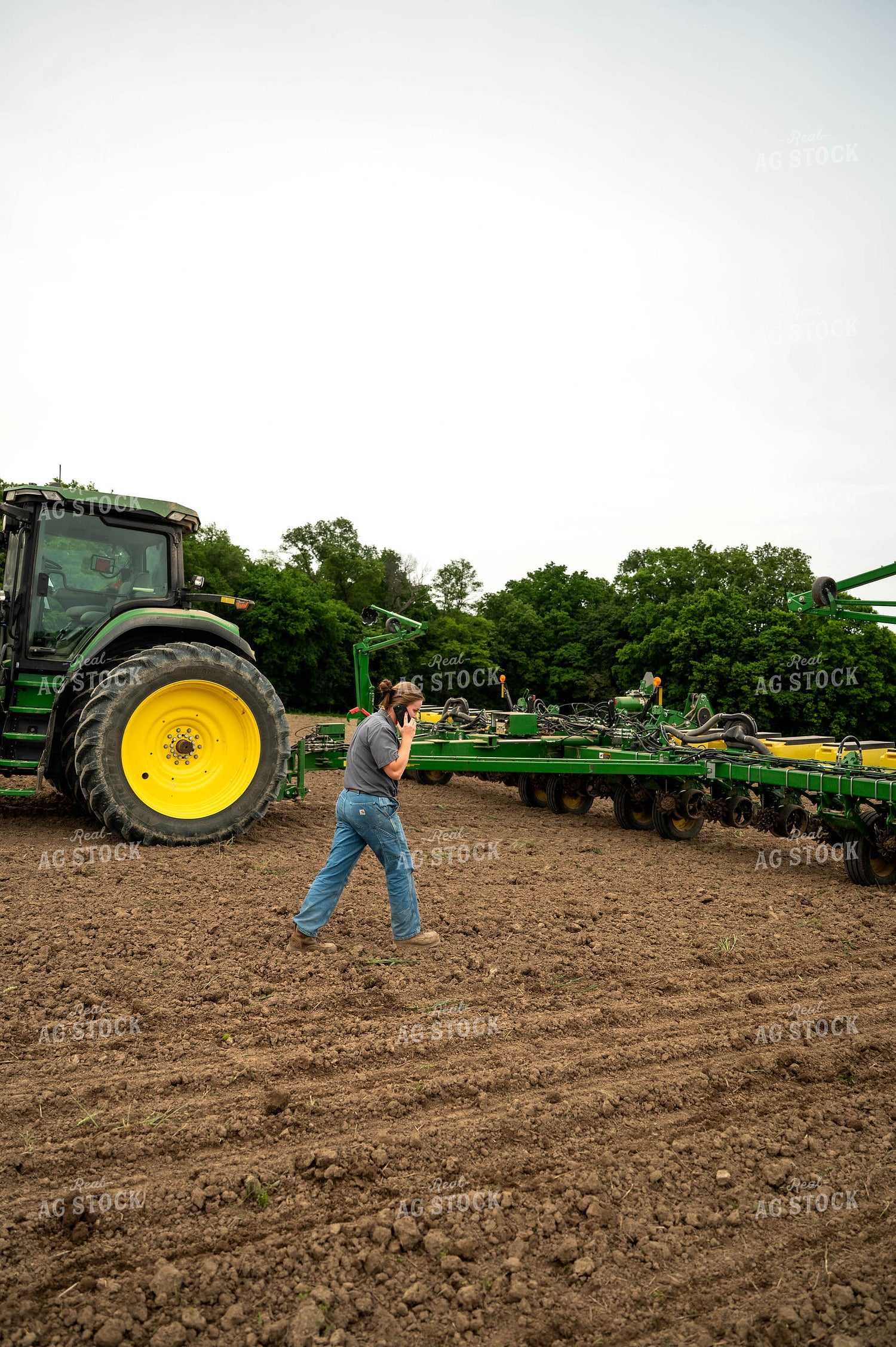 Female Farmer Walking by Planter 115693
