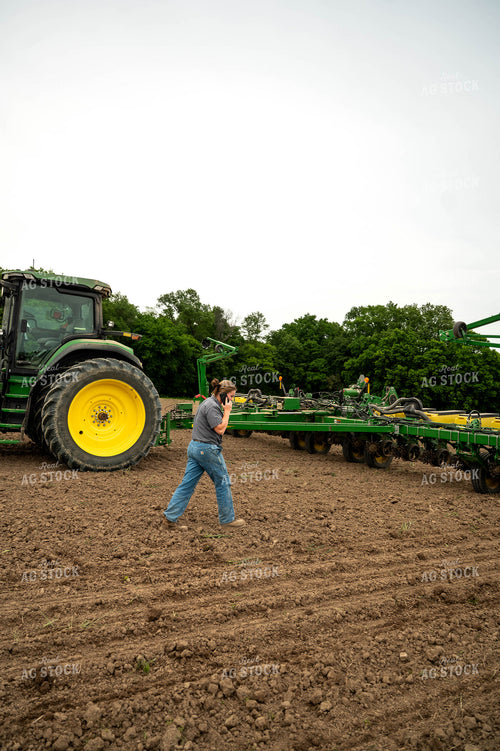 Female Farmer Walking by Planter 115693