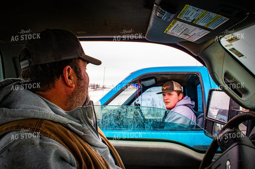 Farmers Talking Across Trucks 214065