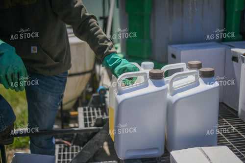 Farmer Mixing Chemicals for Self Propelled Sprayer 191075