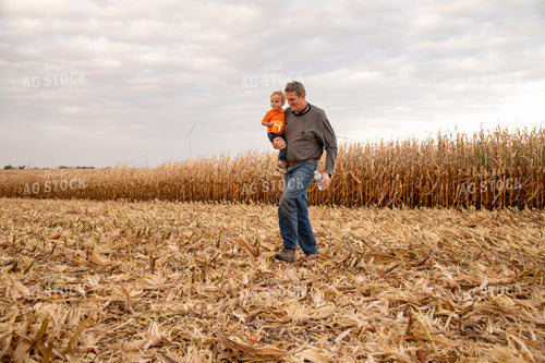 Grandson and Grandfather Farmer in Field 25831