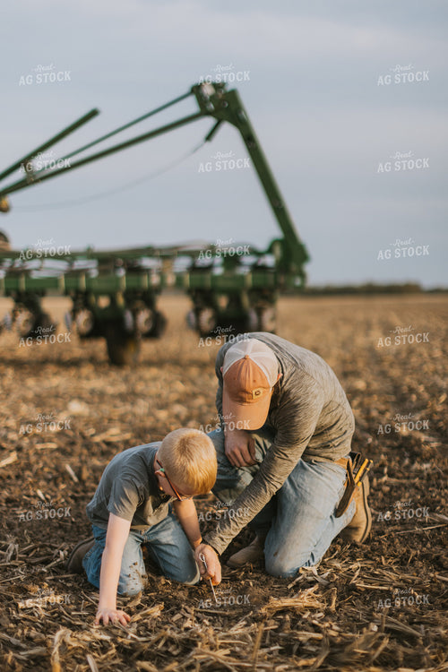 Farmer Checking Seed Depth with Son 8223