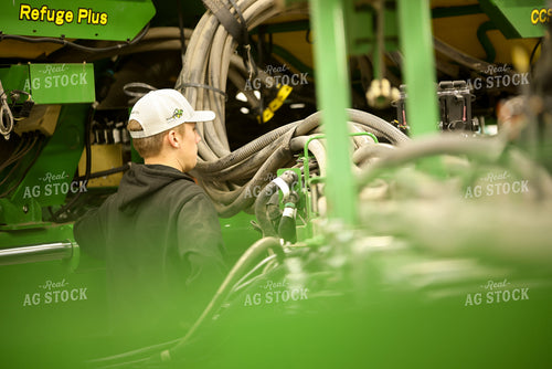 Farmer Fixing Planter 161119