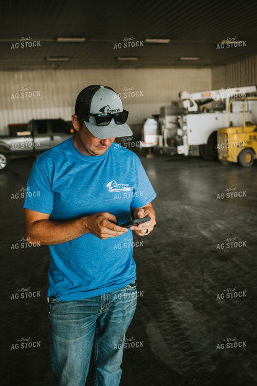 Farmer on Phone in Farm Shop 6203