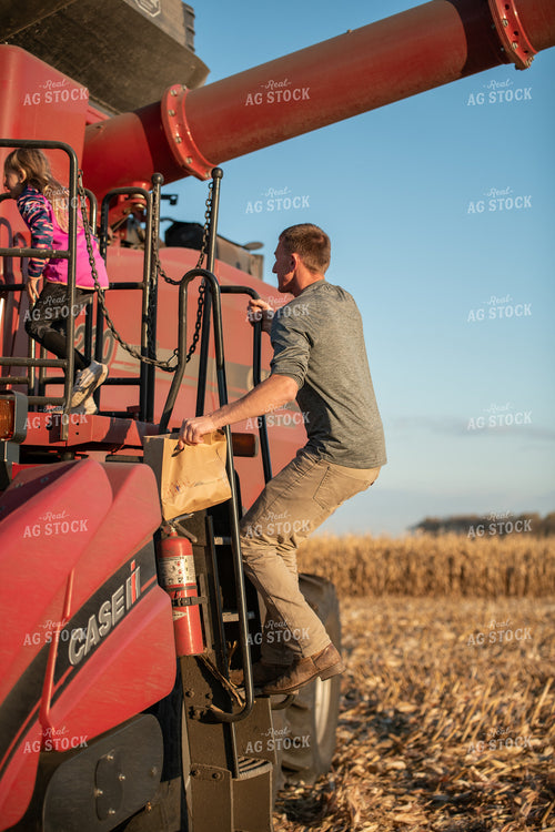 Farmer and Kids Climbing into Combine 76506